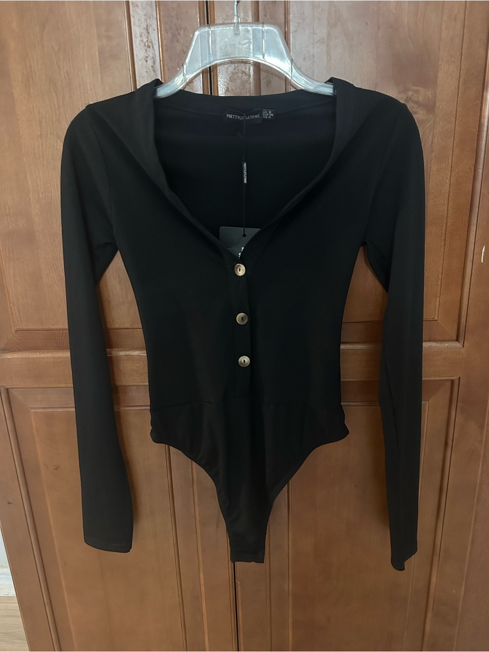 PrettyLittleThing Black Ribbed Long-Sleeve Button-Up Bodysuit